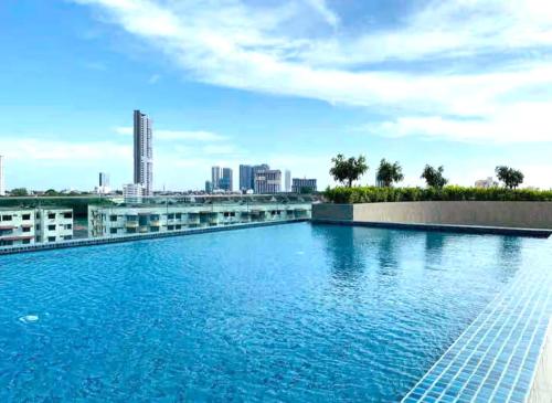 a swimming pool on the roof of a building at NOVO 8 Residence Melaka in Malacca
