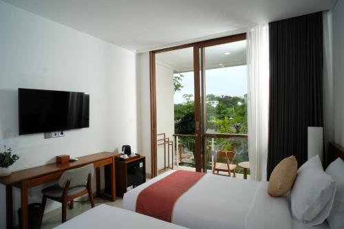 Giường trong phòng chung tại The Ledge Uluwatu