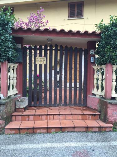 a gate to a house with a brick walkway at B&B Girasole in Colleferro