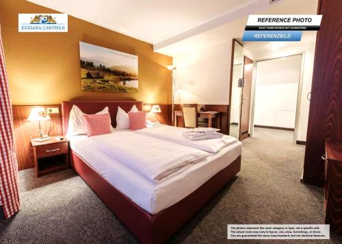 Giường trong phòng chung tại Hotel Enziana Wien