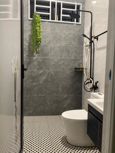 a bathroom with a shower with a toilet and a sink at RusanHome Pengkalan Chepa in Pengkalan Cepa