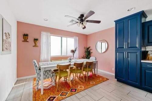 a dining room with a table and chairs at Spacious home w private pool & game room in Phoenix