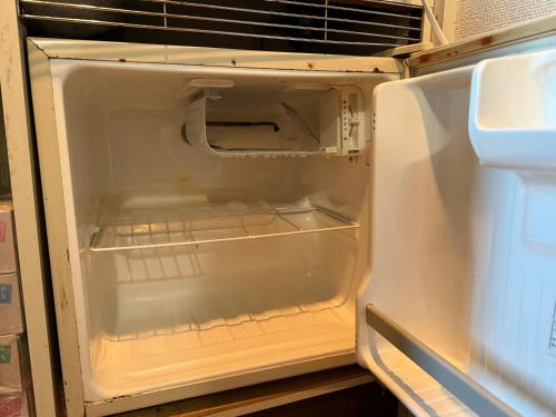 an empty refrigerator with its door open at #29 -フェイズ立川- Entire Unit in Tachikawa