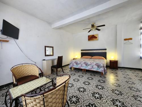 En eller flere senge i et værelse på Hacienda San Miguel