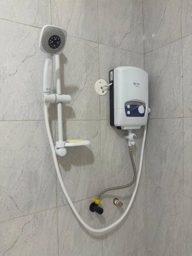 a hair dryer is attached to a wall at Serene 3-Bedroom House in Pridelands, Nairobi in Syokimau