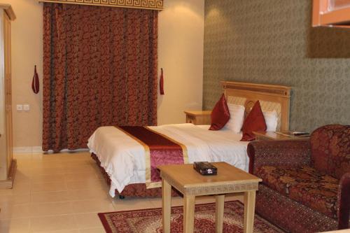 a hotel room with a bed and a couch at Makarim Najd 4 in Riyadh