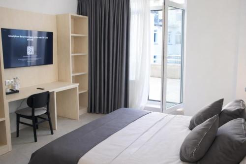 Ein Bett oder Betten in einem Zimmer der Unterkunft Niko Hotel am Hannover Hbf