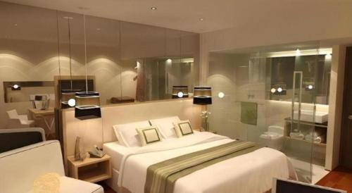 En eller flere senge i et værelse på Horison Ultima Semarang