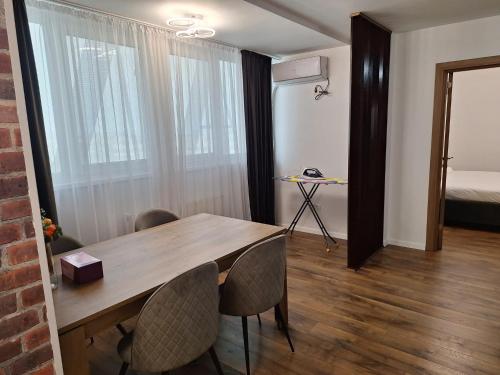 En eller flere senge i et værelse på Sir Fundeni Hotel