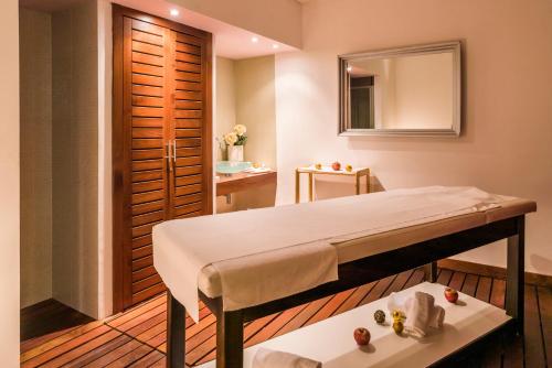 a room with a bed and a mirror at Hotel Garden Istra Plava Laguna in Umag