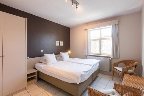 Кровать или кровати в номере Bonobo Apartments