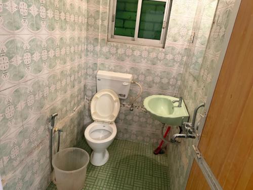 Et badeværelse på Vailankanni Guest House