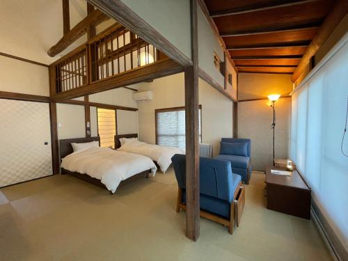 Postel nebo postele na pokoji v ubytování ゲストハウス真鶴の家-Guest House Manazuru House