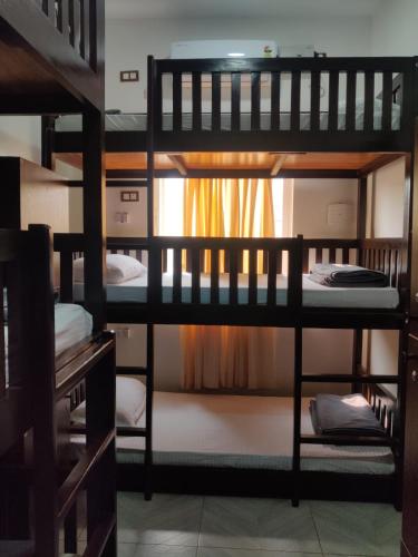 a group of bunk beds in a room at Kanasu Serenity in Gokarna