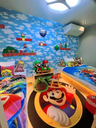 a bedroom with two twin beds with mickey characters on the walls at SMILE HOUSE close to USJ Mario Kidsroom high class kitchen bath easy to Kobe Nara 10mins to downtown by train up to 6ppl in Osaka