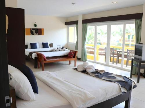 Giường trong phòng chung tại Bacchus Home Resort