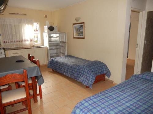 Una cama o camas en una habitación de Rincon del Sol