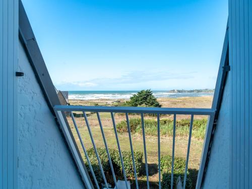 a view of the ocean from the balcony of a house at Sud Ocean M N105 2P5 in Guidel