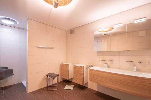 a bathroom with a tub and a sink at Traumwohnung in Norderney