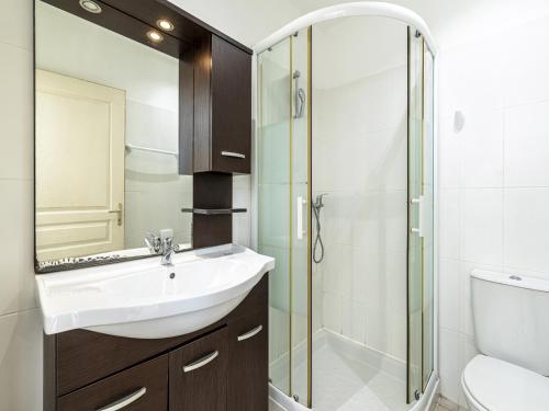 a bathroom with a sink and a shower at Lisa Maria E N60 3P7 in Sari Solenzara