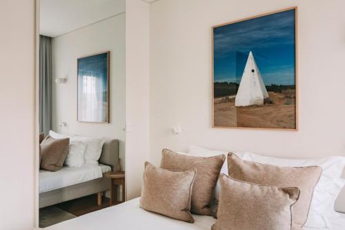 En eller flere senge i et værelse på Torel Lenscape