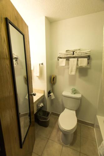 a bathroom with a toilet and a sink and towels at Super 8 by Wyndham Price in Price