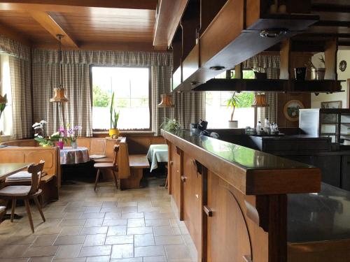 a kitchen with a counter and a dining room at Kremstalhof in Gföhl