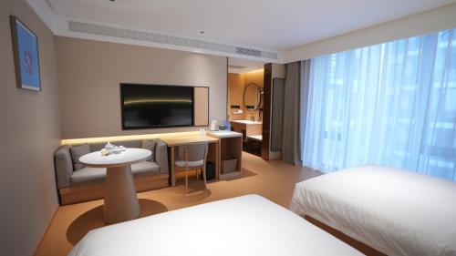 En eller flere senge i et værelse på W Yado Hotel