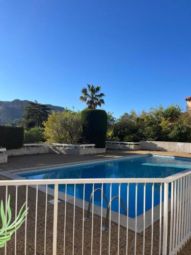 a swimming pool with a fence around it at Lou soulèu in Cassis
