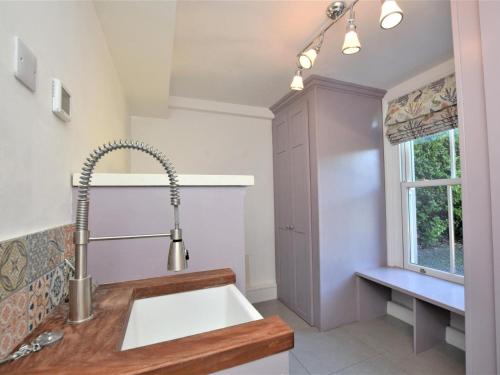 a kitchen with a sink and a window at 5 Bed in Sandown oc-87008 in Sandown