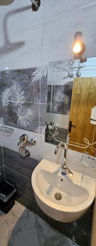 a bathroom with a sink and a mirror at Queen House in Aswan