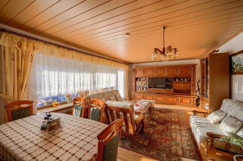 a living room with a couch and a table at Ferienwohnung in Lichtenfels mit 125 Quadratmeter in Lichtenfels