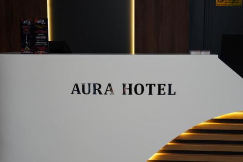 a sign for a naara hotel on a runway at AURA camping in Zhezdi