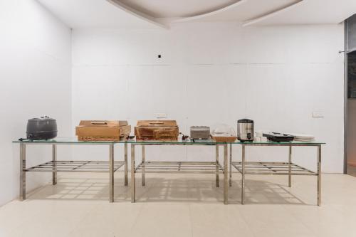 a table with boxes on it in a room at Treebo Advantage Inn in Allahābād