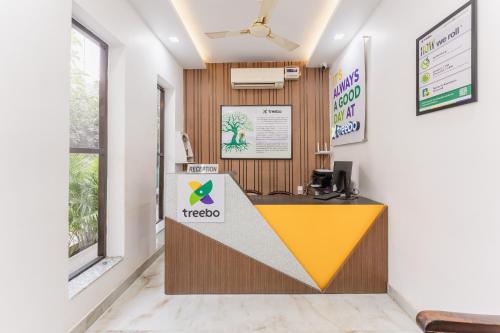 a reception area of a office with a reception desk at Treebo Advantage Inn in Allahābād