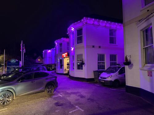 a group of buildings with purple lights on them at Preston Park Hotel in Brighton & Hove
