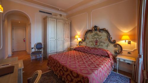 Postel nebo postele na pokoji v ubytování Hotel Cannero