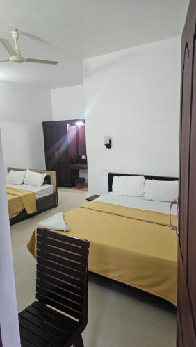 Giường trong phòng chung tại ThekkadyPknhomes