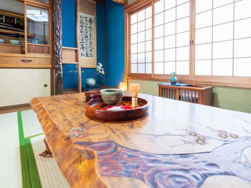 a kitchen with a table with a bowl on it at tazuraya-seto-一棟貸切-無料駐車場 in Takamatsu