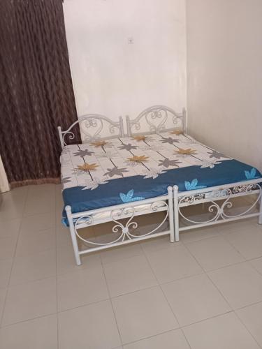 En eller flere senge i et værelse på Hôtel la Rèsidence de la mairie de Mèckhe