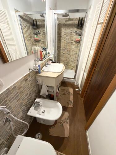 a bathroom with a sink and a toilet at CasaVacanze Roccaraso in Roccaraso