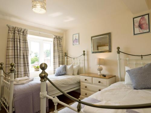 En eller flere senge i et værelse på Church View - Ukc2302