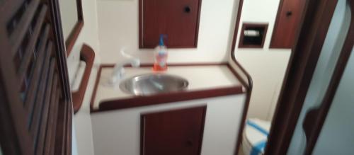 a bathroom with a sink and a mirror at Resort chic on the water! in Key West