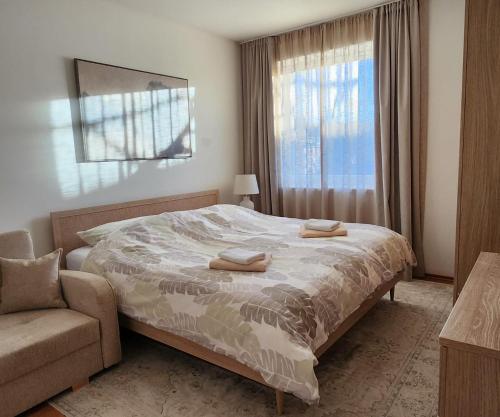 En eller flere senge i et værelse på Apartment Olivia