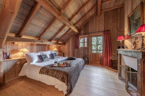 En eller flere senge i et værelse på Le Chalet l'Harmonie - Pierres d'Histoire