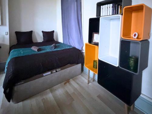 En eller flere senge i et værelse på Le Nexus