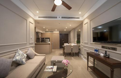 a living room with a couch and a table at Beachfront Luxury Apartment - Rooftop pool - Da Nang in Danang