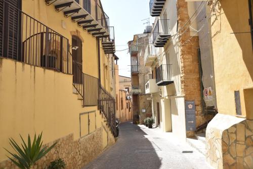an alley in an old town with buildings at Meithras Holiday Homes in Agrigento