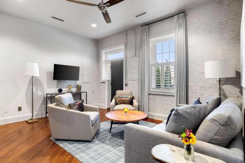 a living room with two couches and a table at Perfect Location - King Street Condo in Charleston