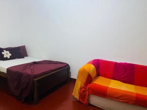 En eller flere senge i et værelse på Bole Guest Bentota